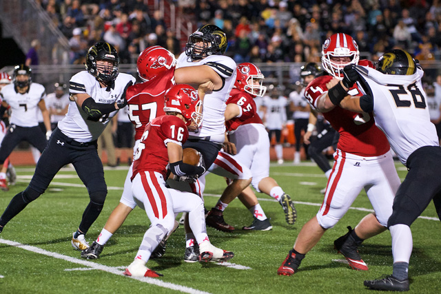 Senior Travis Jones tries to slip through a hole on the offensive line in a Rocket football game last year. Jones is one of the key returning players for RHHS this year.