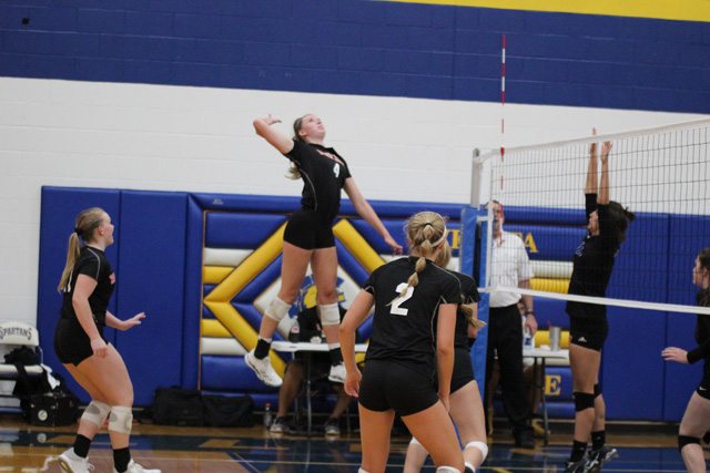 Senior Gracie Van Driel goes up for a block in the Rockets victory over Collegiate on August 28.