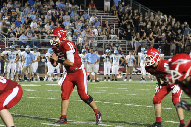 Quarterback Tyce Carlson stands back in the shotgun, waiting to receive the snap. Carlson threw for 378 yards and three touchdowns in the Rockets 22-18 loss to Clearwater. Photo courtesy of Amy Bischler