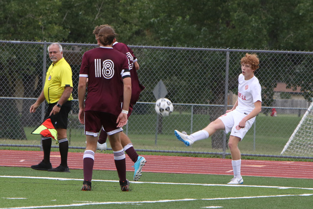 Caden Dinkel kicks the ball in against Buhler in the fifth place game of the Campus/Goddard Tournament. The Rockets lost 4-1, with Dinkel scoring their lone goal.