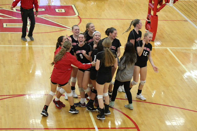 The+Rocket+volleyball+team+celebrates+their+sub-state+victory+over+Nickerson+on+Saturday%2C+October+21.+The+Rockets+are+the+fourth+seed+at+the+state+tournament+in+Hutchinson.